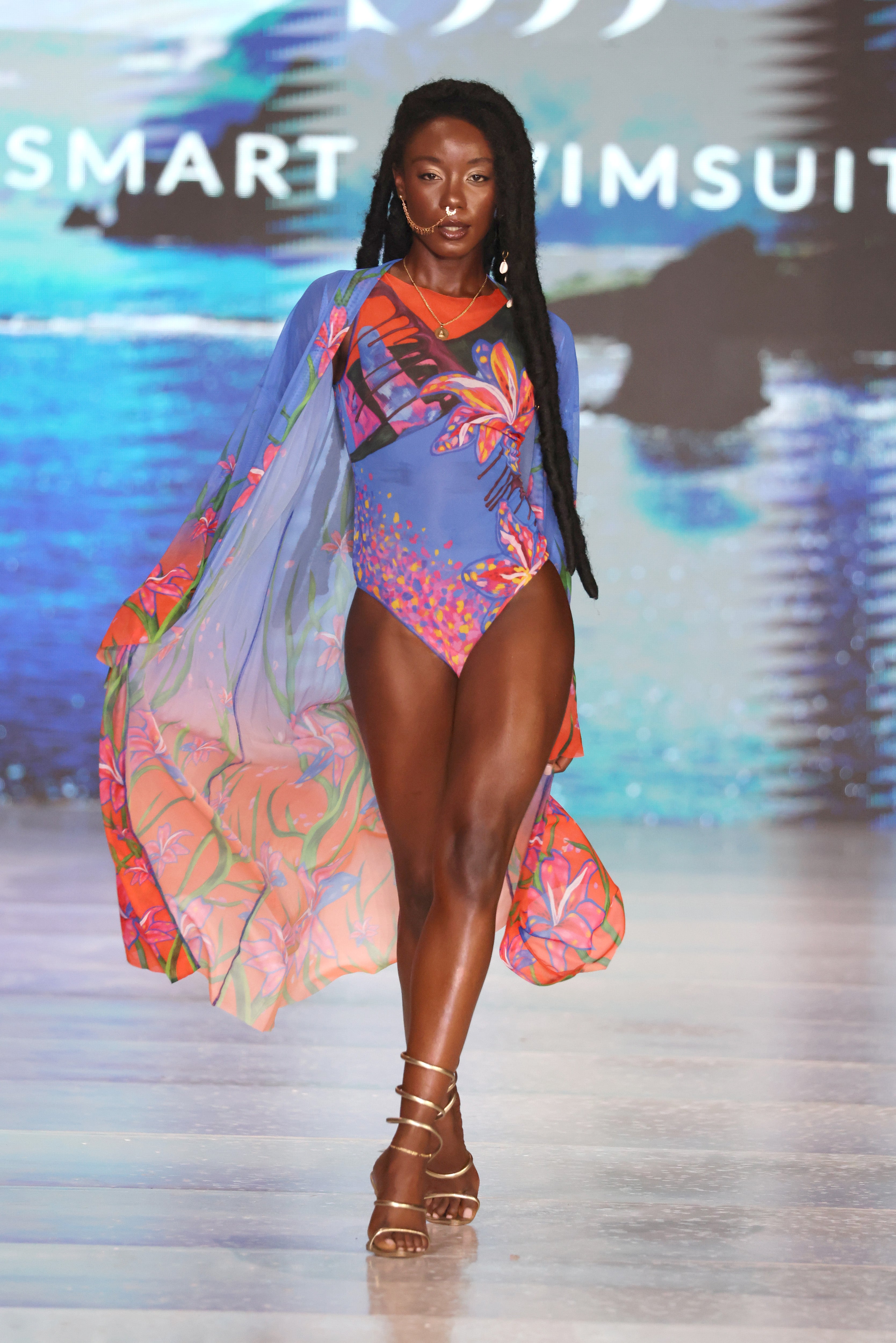 This text promotes a sustainable Lily print sleeveless swimsuit featuring SPF35 protection. It highlights the swimsuit's blend of classic luxury and eco-friendly style. The text encourages users to click to explore an innovative tan-through swimwear collection.