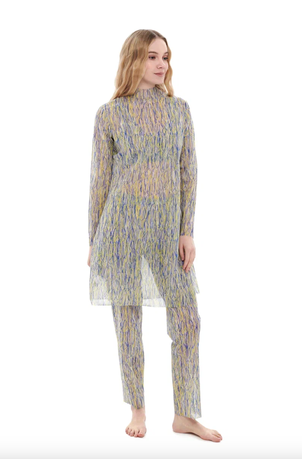 This file describes a tan-through, innovative, sustainable burkini set with a 3DPen print. The set includes a top, leggings, and a tunic, combining classic luxury with modest fashion. It includes a call to action to shop for this stylish and eco-friendly swimwear.