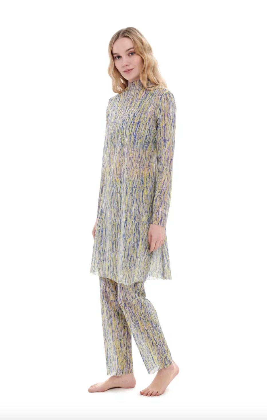 This file describes a tan-through, innovative, sustainable burkini set with a 3DPen print. The set includes a top, leggings, and a tunic, combining classic luxury with modest fashion. The description encourages shopping for this stylish and eco-friendly swimwear.