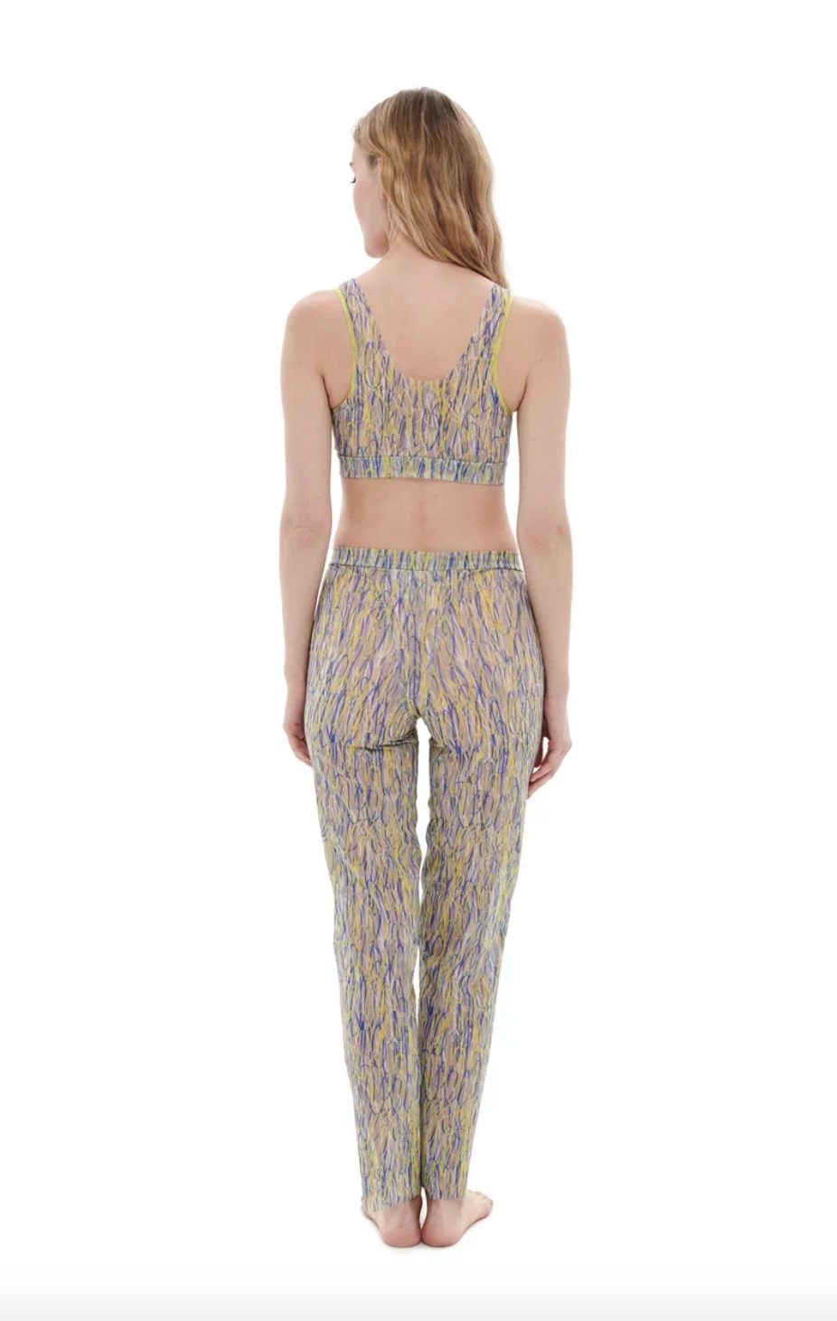 This file contains a description of a tan-through, innovative, sustainable burkini set with a 3DPen print. The set includes a top, leggings, and a tunic, combining classic luxury and modest fashion. The description also includes a call to action to shop for this stylish and eco-friendly swimwear.