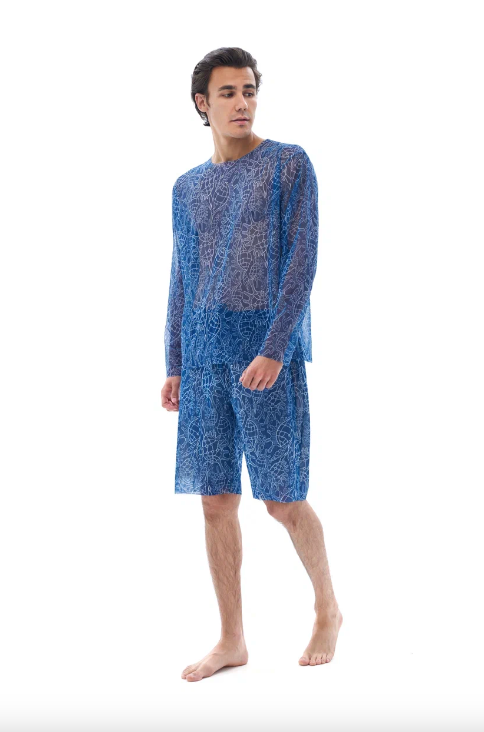 This file describes tan-through, sustainable Men's Smart Swim Trunks Bermudas in SHELLS print. It combines innovation and classic luxury for modest fashion. Shop now!