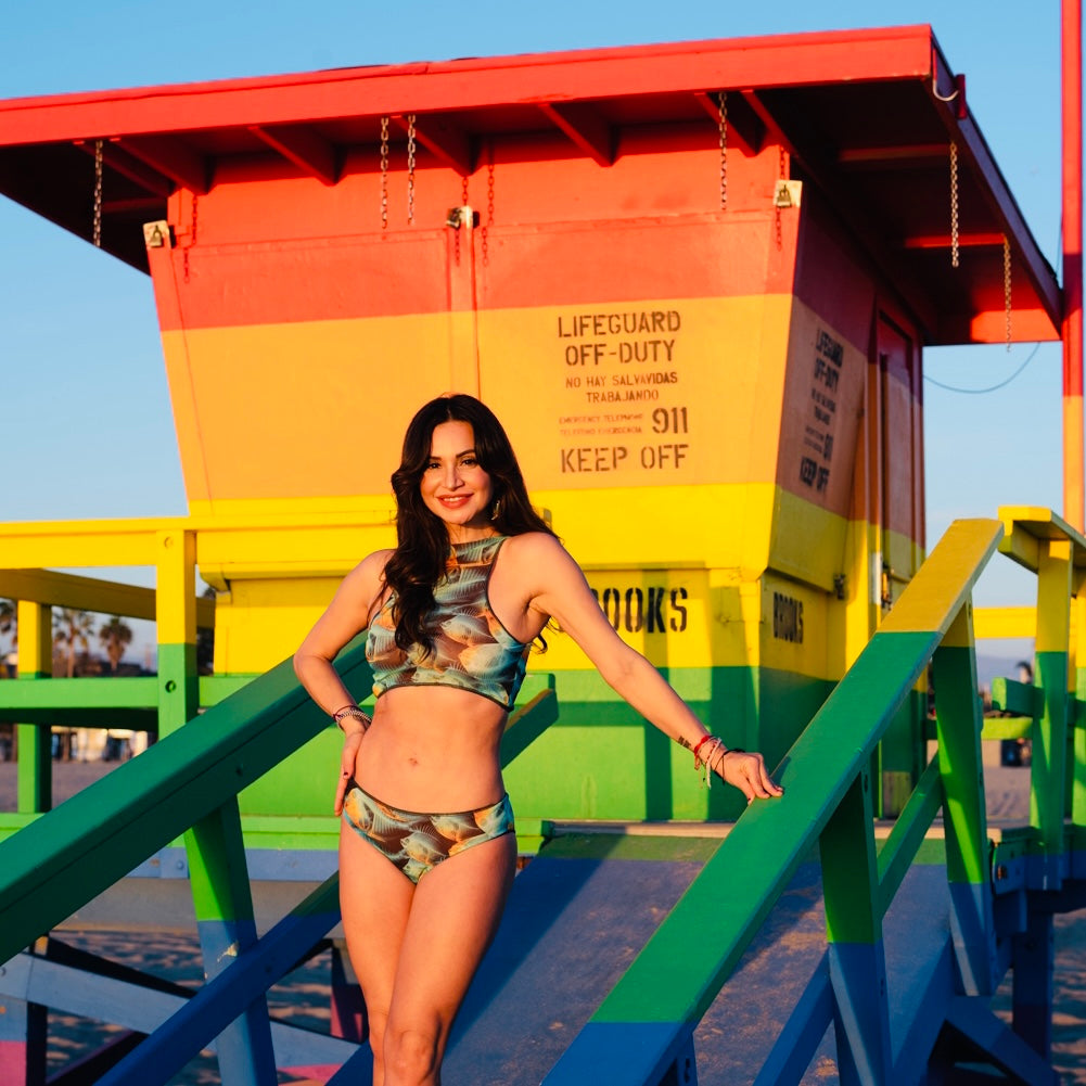 This file contains a collection of tan-through swimsuits in a classic fish print. With built-in SPF35 protection, these bikinis offer both style and sun safety. Click to shop now!