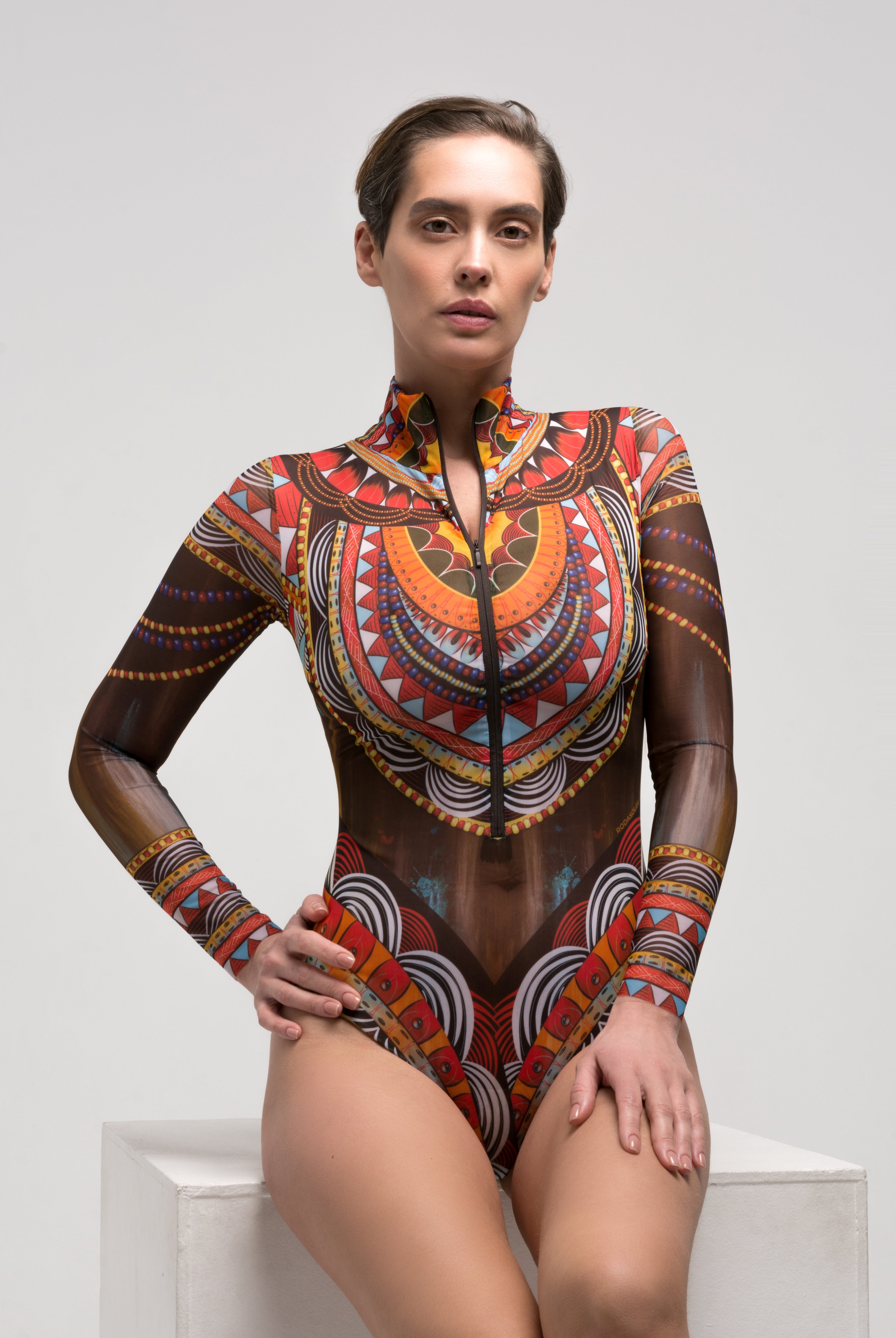 This file showcases the world's leading smart swimsuit brand, known for innovation and sustainability. Featuring the Africa print, the one-piece with sleeves and zipper offers runway-inspired style. Ideal for individuals with visual impairment or low-bandwidth connections