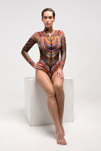 Load image into Gallery viewer, This file presents the epitome of innovation and sustainability in smart swimwear, showcasing our globally recognized brand. Featuring the Africa print, this one-piece with sleeves, zipper, and tan without tan lines technology exudes runway-worthy style
