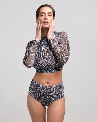 Discover sustainable tan-through smart swimsuits featuring a trendy Fake Zebra print in this file. Included is a high-waist bikini offering SPF35 protection for sun-safe sophistication.