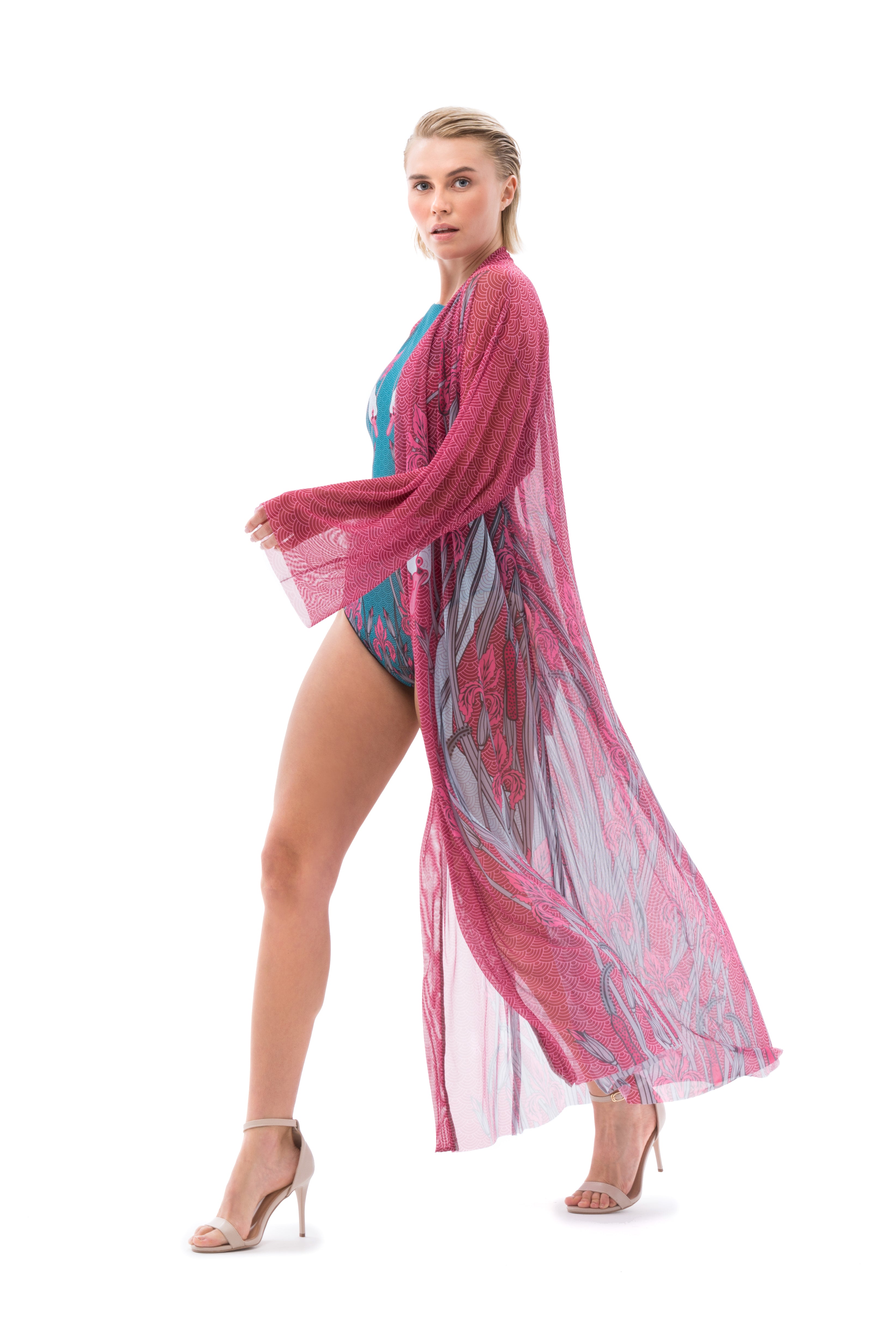 This file showcases sustainable tan-through smart swimsuits with a swans print. It features beach robes with SPF15 protection, offering classic luxury and iconic style for beach outings.