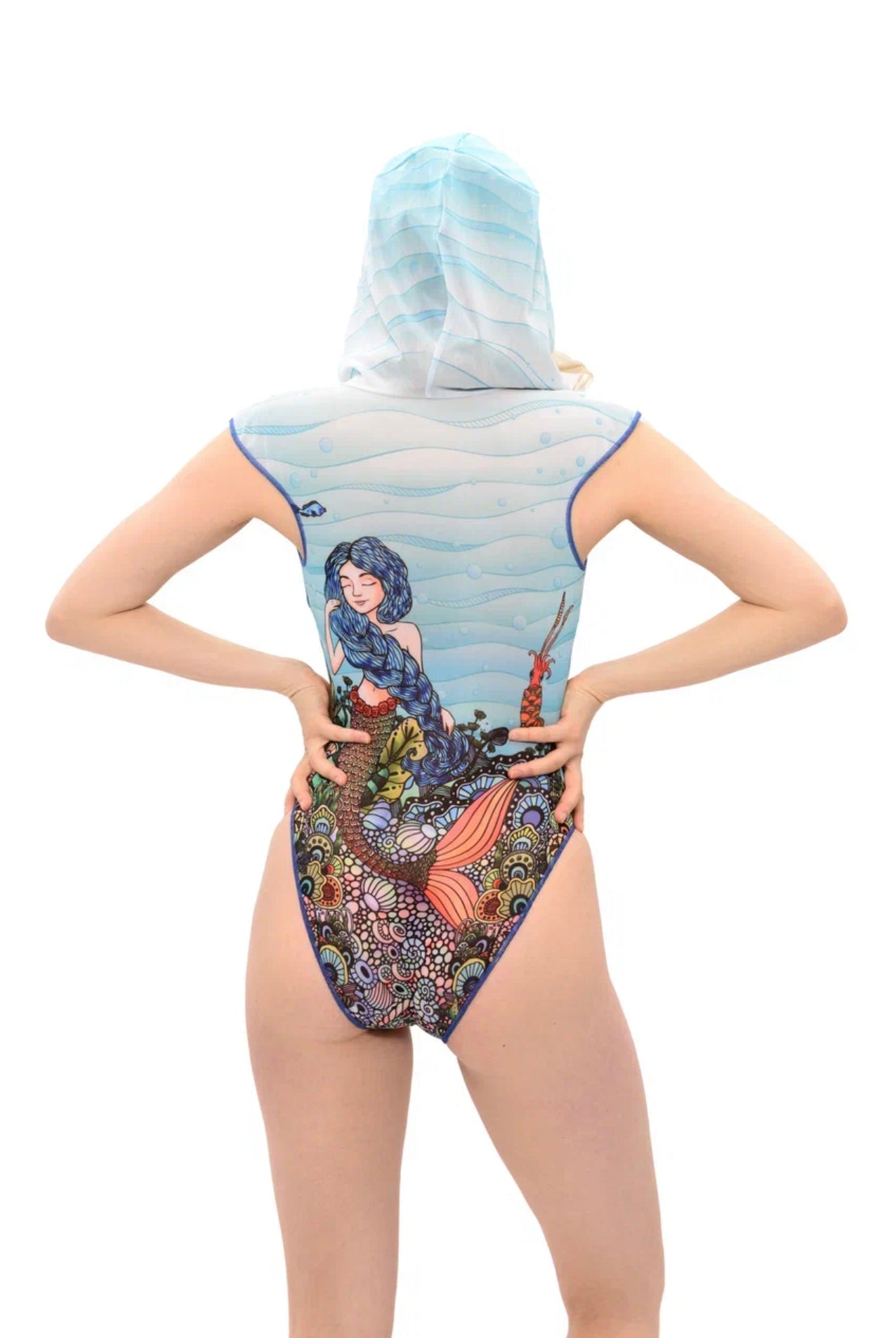 Explore our collection of sustainable tan-through swimsuits in a mermaids print. Each swimsuit features a unique design with a hood and lace, providing SPF35 protection. Experience classic luxury and shop now!