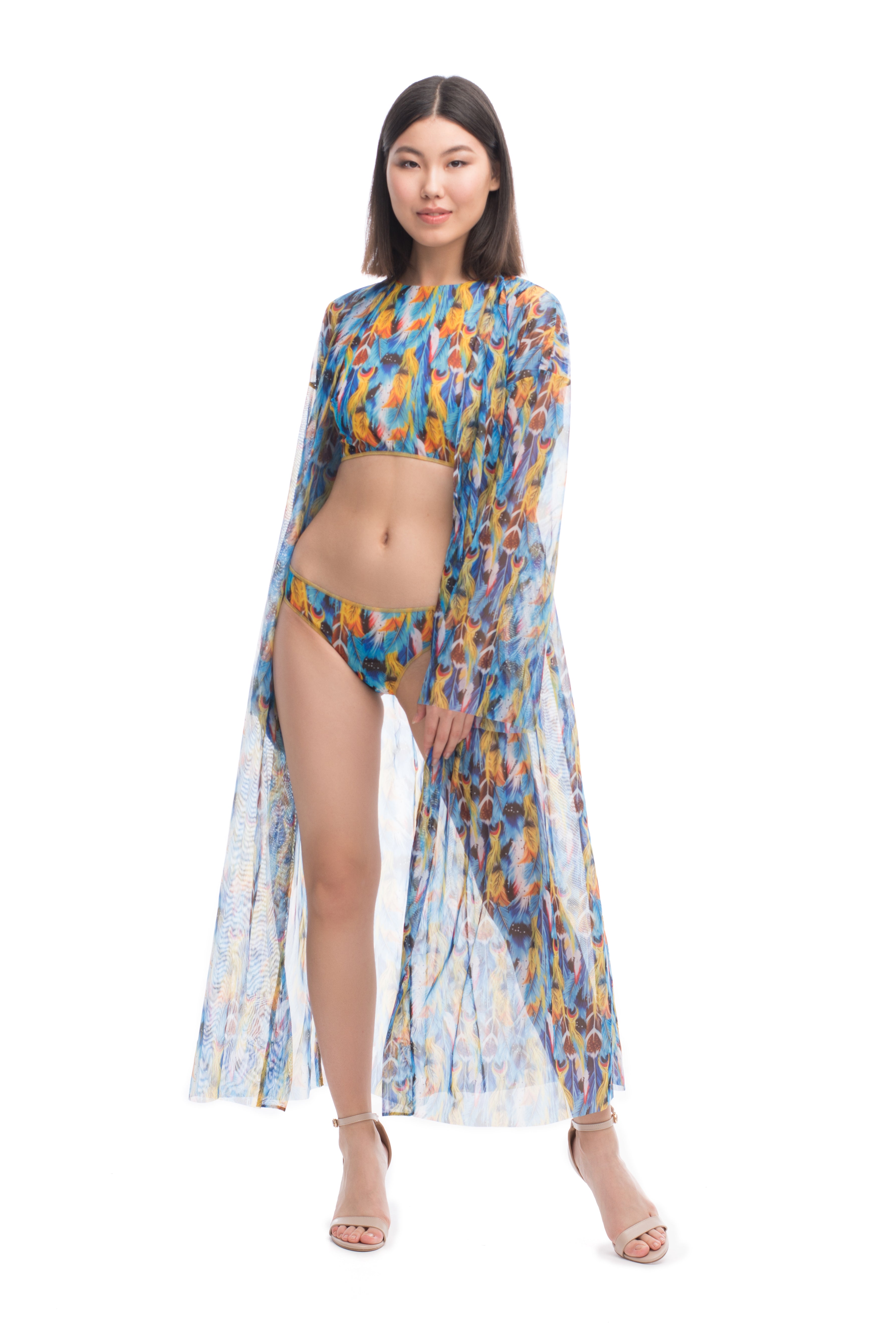 This file introduces sustainable smart swimsuits featuring a fashionable feather print. Designed for beachgoers, it highlights a beach robe made from tan-through fabric with SPF 15 protection