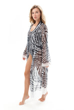 Load image into Gallery viewer, This file presents sustainable tan-through smart swimsuits adorned with a trendy Fake Zebra print. Included is a Beach Robe offering SPF35 protection, embodying a new classic beachwear style
