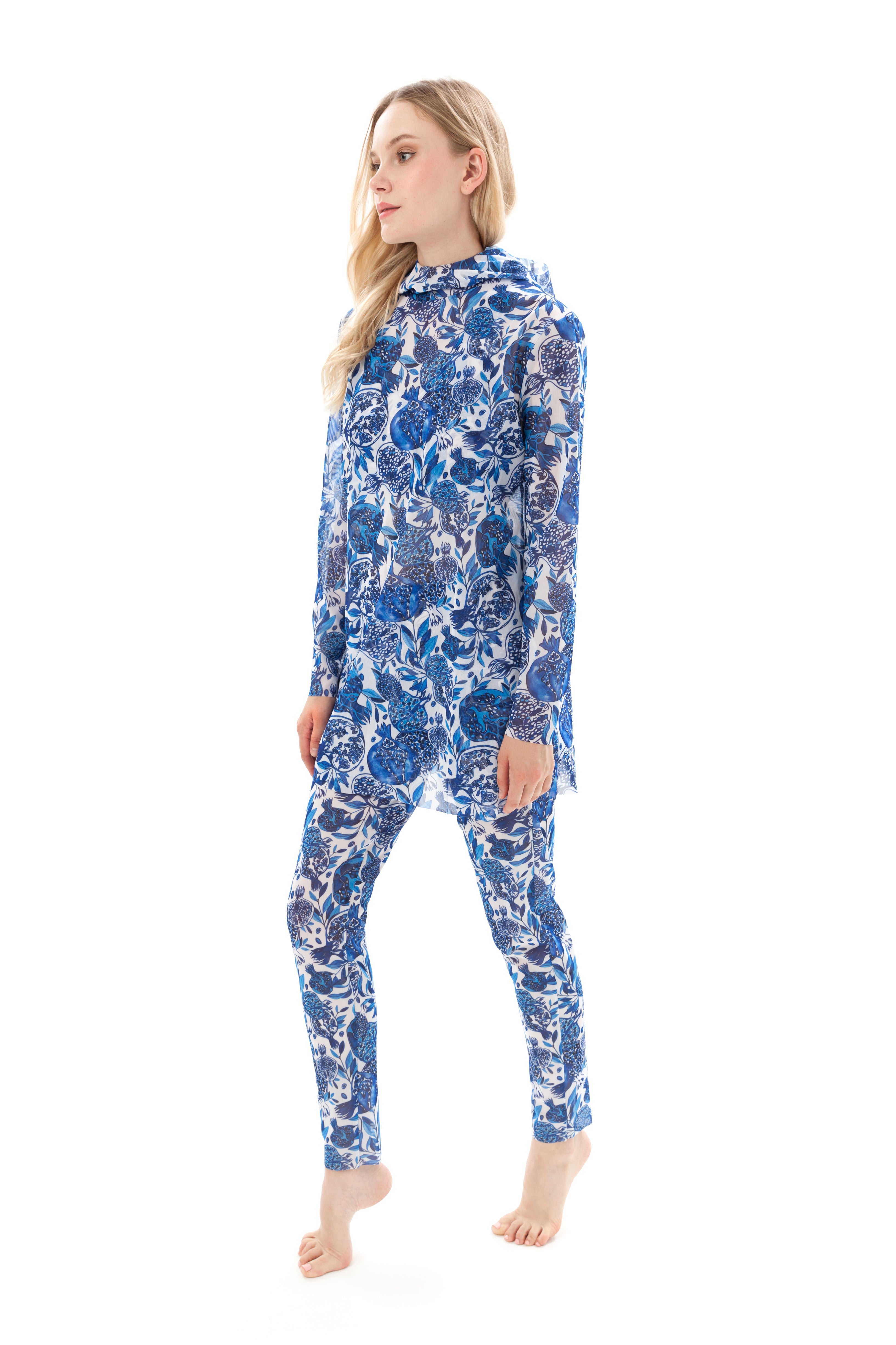 Explore our Pomegranate print burkini set, featuring a top, leggings, and tunic. This collection combines classic luxury and modest fashion with sustainable innovation. Perfect for stylish and eco-friendly swimwear. Shop now!