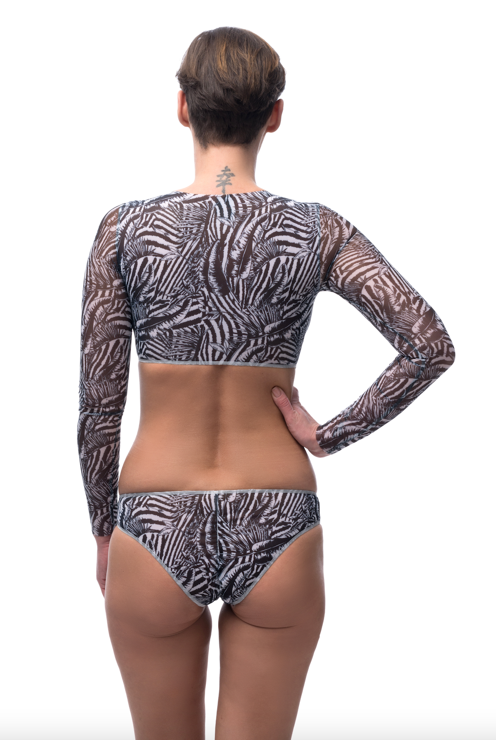 Explore sustainable tan-through smart swimsuits adorned with a trendy Fake Zebra print in this file. Included is a classic bikini offering SPF35 protection for sun-safe sophistication.