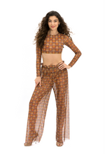 Load image into Gallery viewer, This file contains a concise summary of sustainable smart swimwear, specifically Africa print beach pants with SPF 15 protection. It&#39;s designed for individuals with visual impairments or low-bandwidth connections seeking stylish and sun-safe beachwear options

