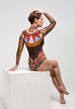 Load image into Gallery viewer, This file showcases the world&#39;s leading smart swimsuit brand, renowned for innovation and sustainability. Featuring the Africa print, the one-piece with sleeves, zipper, and tan-without-tan-lines technology embodies runway elegance
