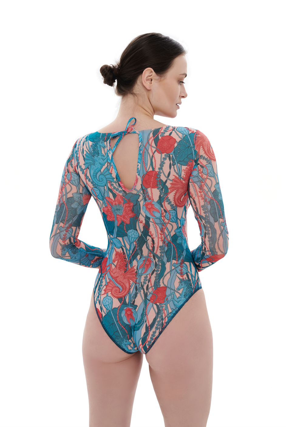 This file showcases sustainable tan-through smart swimsuits adorned with the enchanting Seaunicorns print. Featuring a one-piece swimsuit design with sleeves, it exudes summer luxury and sophistication