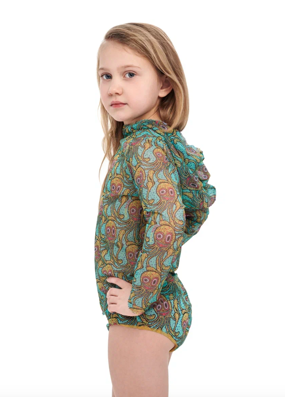 This file describes an Octopus print kid's T-shirt and shorts set that is tan-through, innovative, and sustainable. It offers classic luxury for modest fashion. Shop now!