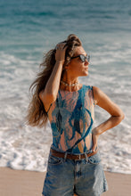 Load image into Gallery viewer, This file showcases sustainable tan-through smart swimsuits featuring a stylish Jellyfish print. Included are sleeveless one-pieces offering SPF35 protection, embodying luxury beachwear.
