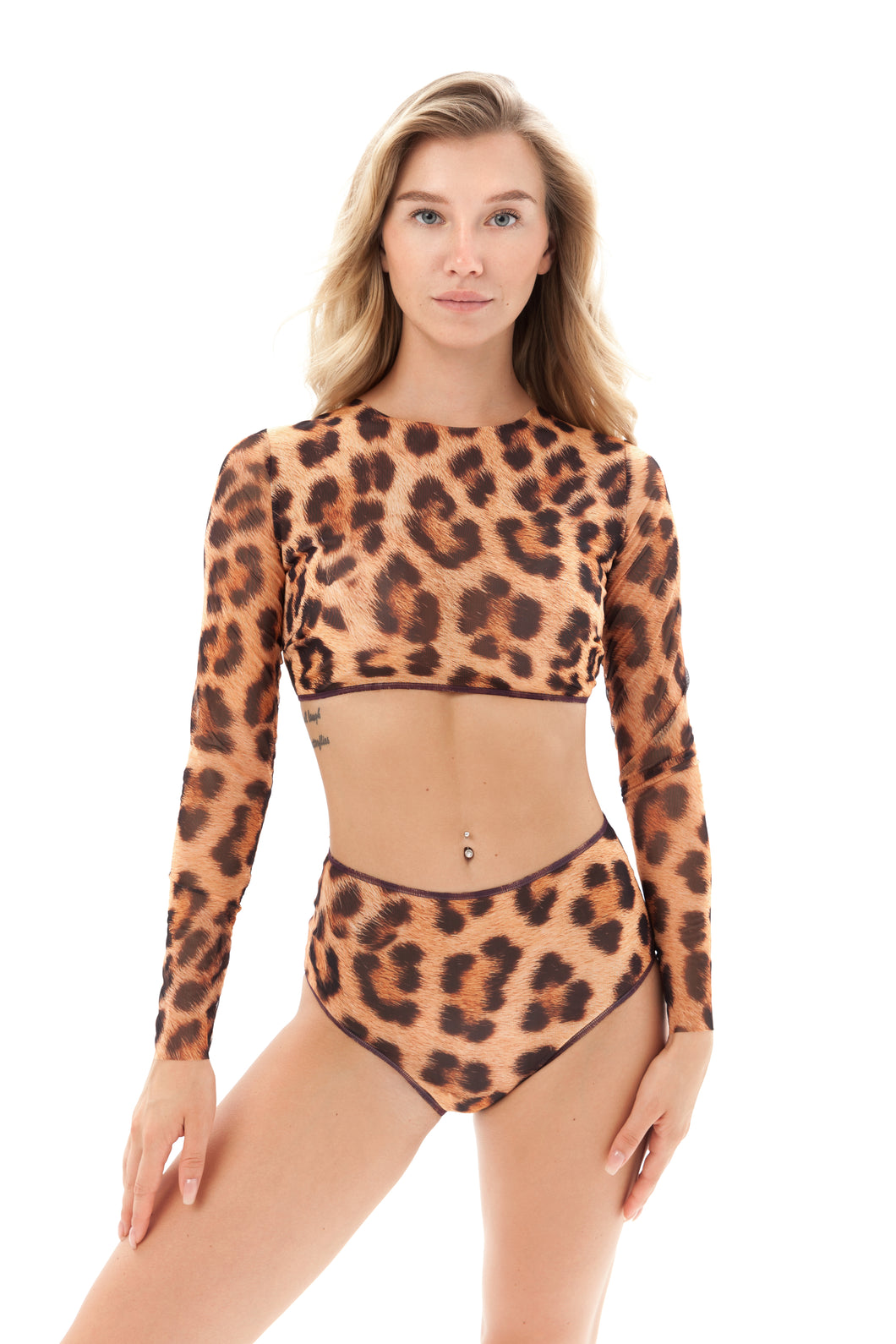 Explore tan-through innovative smart swimsuits adorned with the iconic leopard print in this file. Featuring a two-piece design, including a swim top with sleeves, perfect for runway-inspired vacation looks