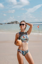 Explore our collection of sustainable tan-through smart swimsuits featuring a classic bikini design adorned with a captivating mermaid print. Enjoy the perfect fit, SPF35 protection, and timeless luxury. Click to shop now!